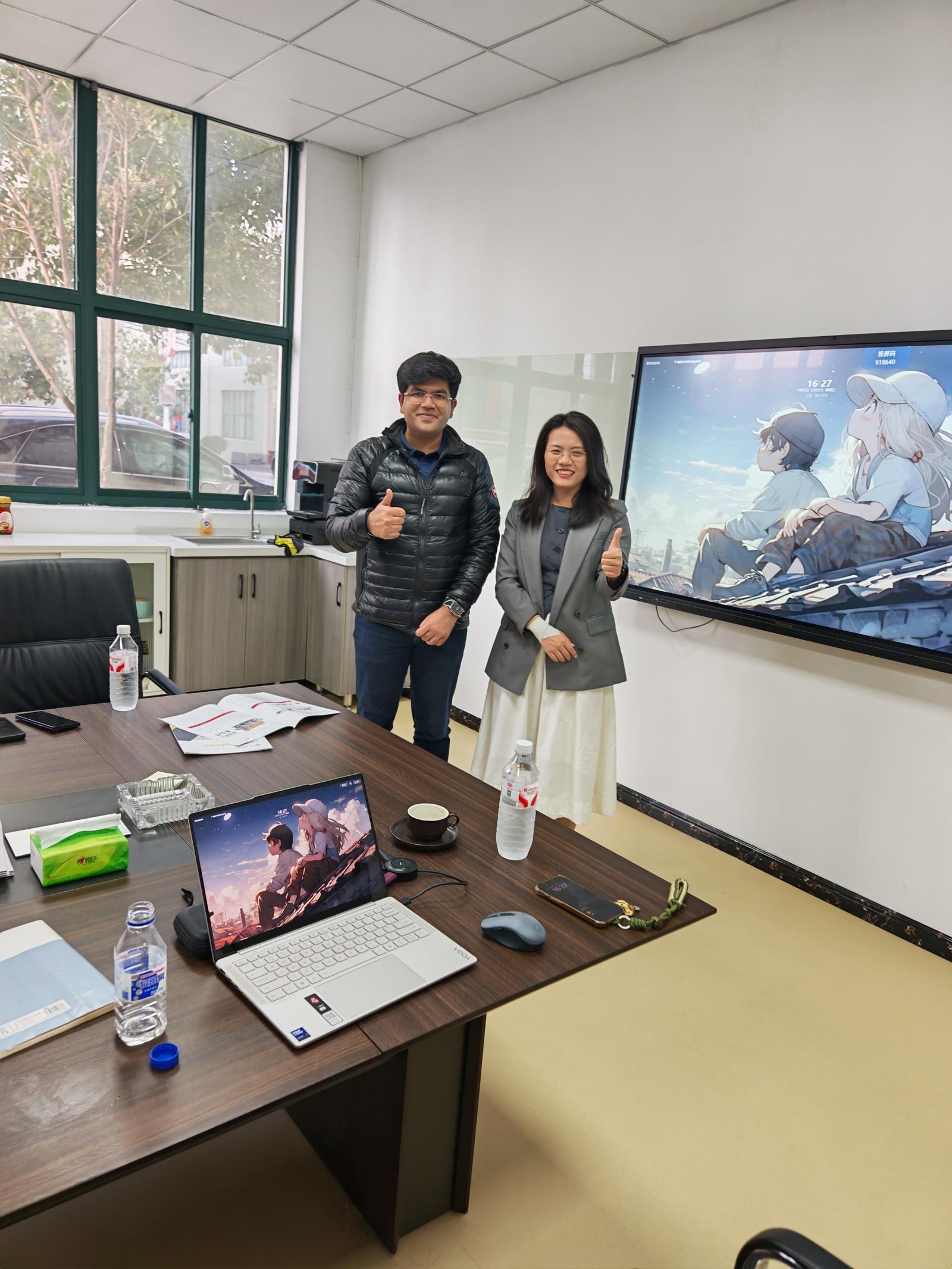 WIN-WIN PACK engineers reviewing a packaging line layout with a visiting customer in the China office